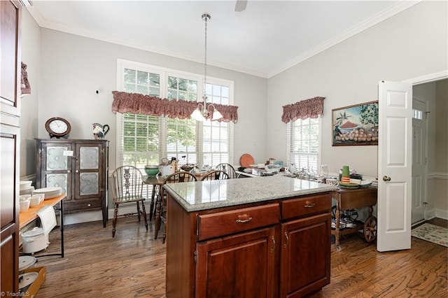 2000 Williamsburg Manor Ct, Winston-Salem, NC 27103 - kitchen featuring dark wood-style flooring, a chandelier, crown molding, pendant lighting, and light stone countertops