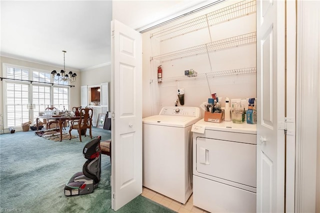 2000 Williamsburg Manor Ct, Winston-Salem, NC 27103 - washroom with washer and clothes dryer, a chandelier, light carpet, and ornamental molding