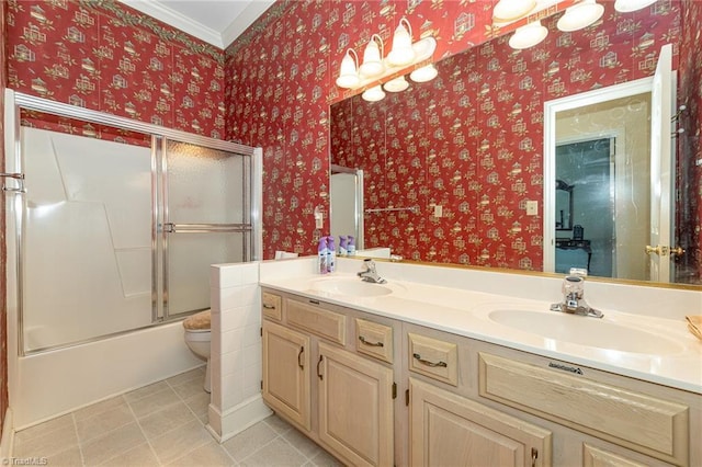 2000 Williamsburg Manor Ct, Winston-Salem, NC 27103 - bathroom featuring double vanity, tile patterned flooring, bath / shower combo with glass door, and ornamental molding
