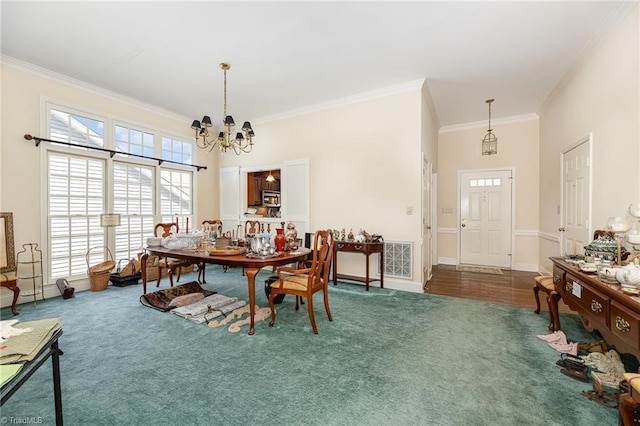 2000 Williamsburg Manor Ct, Winston-Salem, NC 27103 - carpeted dining area featuring ornamental molding and a chandelier
