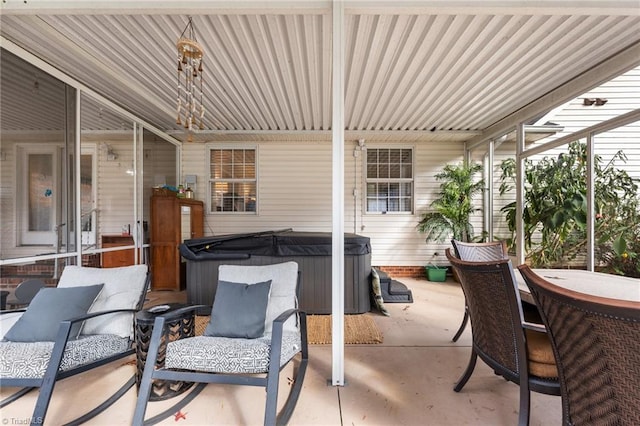 view of patio / terrace with a hot tub