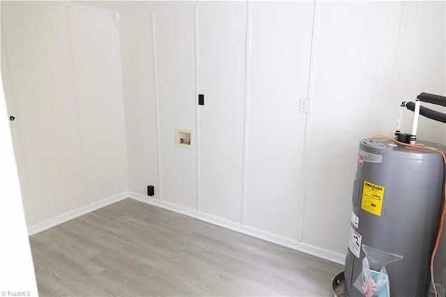 utility room featuring water heater