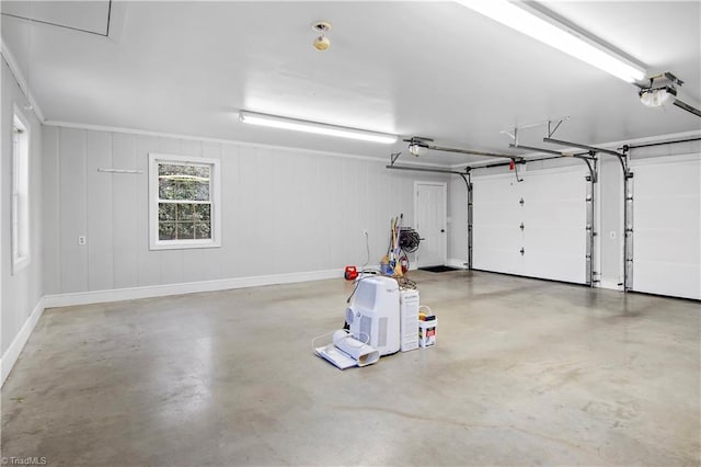 garage with baseboards and a garage door opener