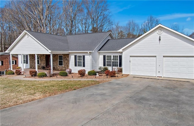 ranch-style house featuring roof with shingles, a garage, stone siding, driveway, and a front lawn