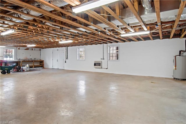 garage with water heater and heating unit