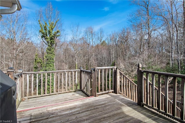 wooden deck featuring area for grilling