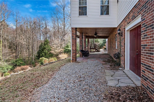 view of yard featuring ceiling fan