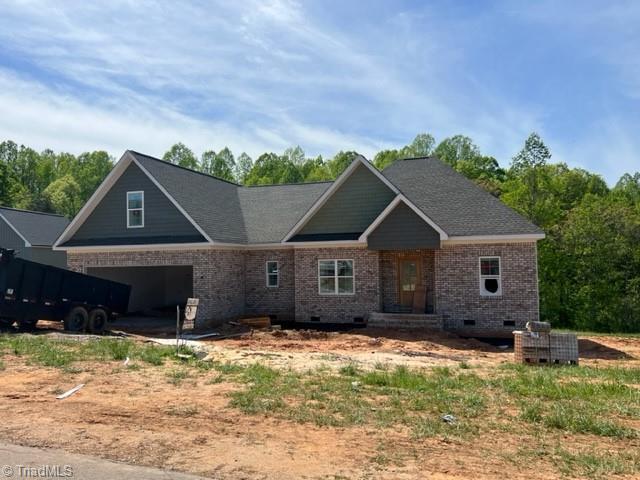 184 Providence Trl, Madison, NC 27025 - craftsman inspired home with brick siding, a garage, crawl space, central air condition unit, and driveway