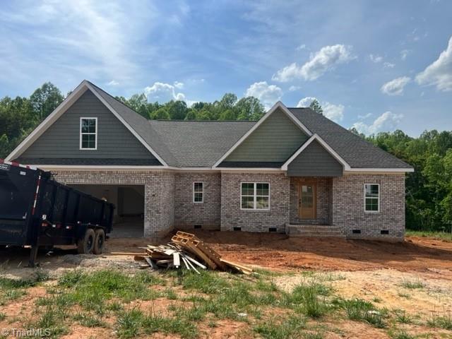 184 Providence Trl, Madison, NC 27025 - view of front of home with brick siding, a garage, and crawl space