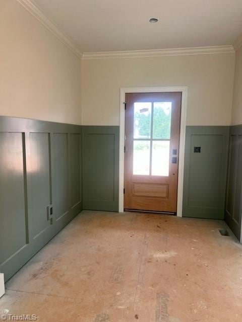 184 Providence Trl, Madison, NC 27025 - doorway with crown molding, a decorative wall, and a wainscoted wall