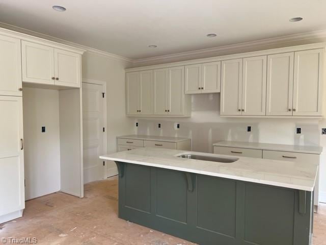 184 Providence Trl, Madison, NC 27025 - kitchen featuring crown molding, white cabinets, and a center island with sink