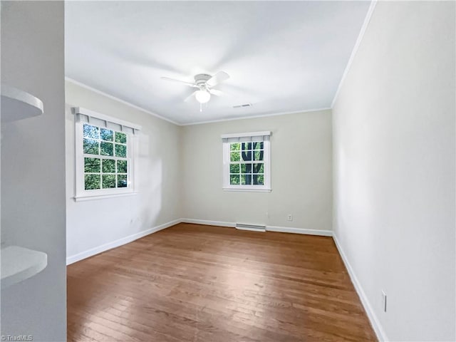 spare room with ornamental molding, hardwood / wood-style flooring, and ceiling fan