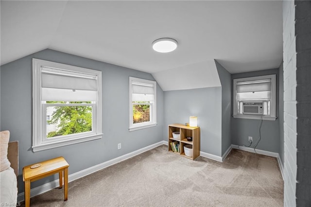 additional living space featuring vaulted ceiling, cooling unit, carpet floors, and baseboards