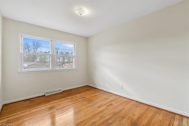 unfurnished room featuring light wood-type flooring