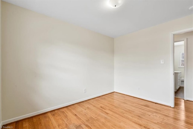 spare room featuring light wood-type flooring