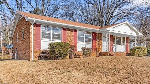 ranch-style home with a front lawn