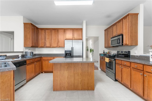 kitchen with stainless steel appliances and a kitchen island