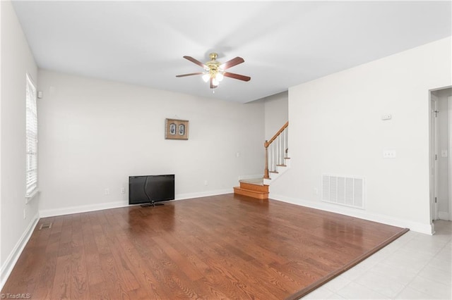 empty room featuring ceiling fan and light hardwood / wood-style floors