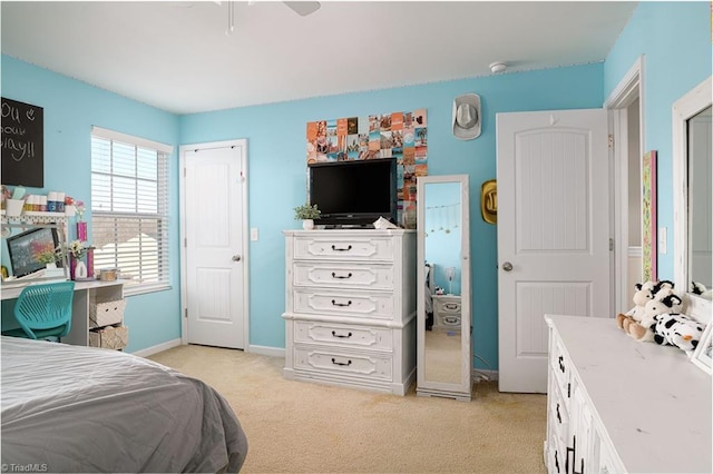 carpeted bedroom with ceiling fan