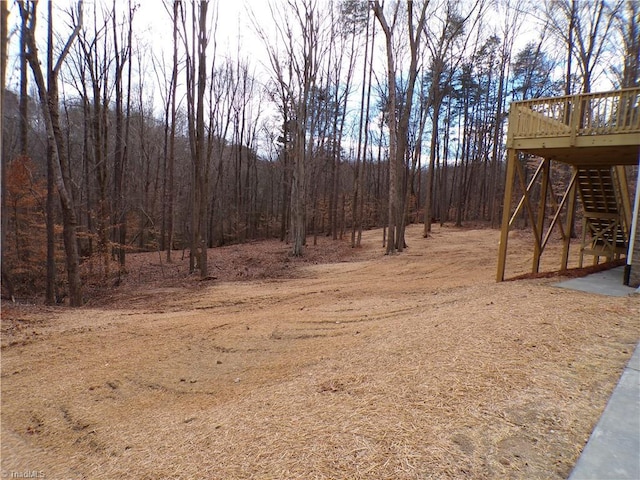 view of yard with a wooden deck