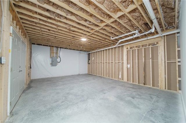 basement featuring electric panel