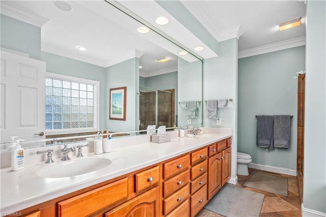 bathroom with a stall shower, a sink, ornamental molding, and baseboards