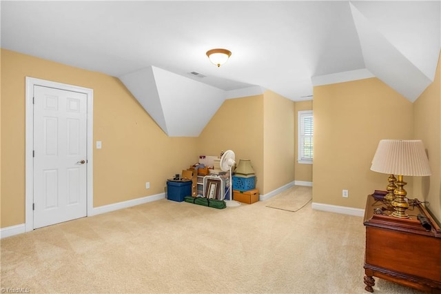 bonus room featuring visible vents, baseboards, lofted ceiling, and carpet floors