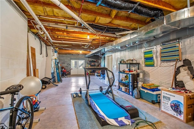 workout area with concrete block wall