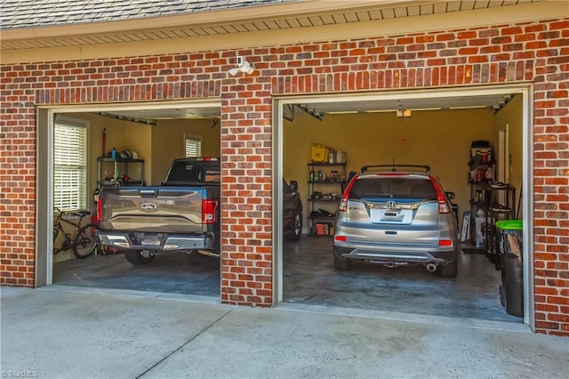 garage with concrete driveway