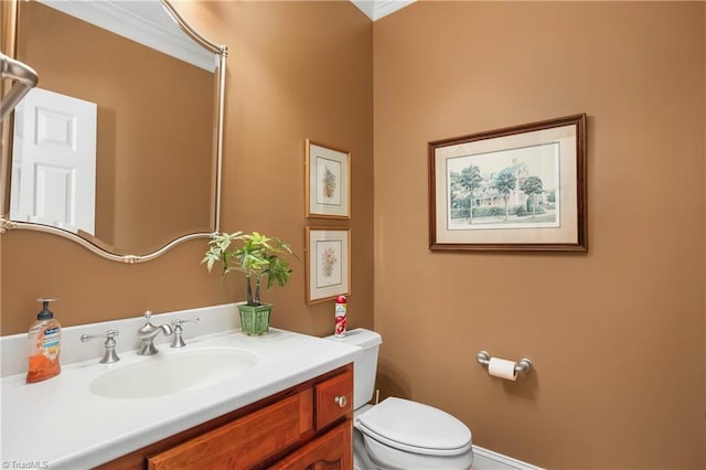 half bathroom featuring vanity and toilet