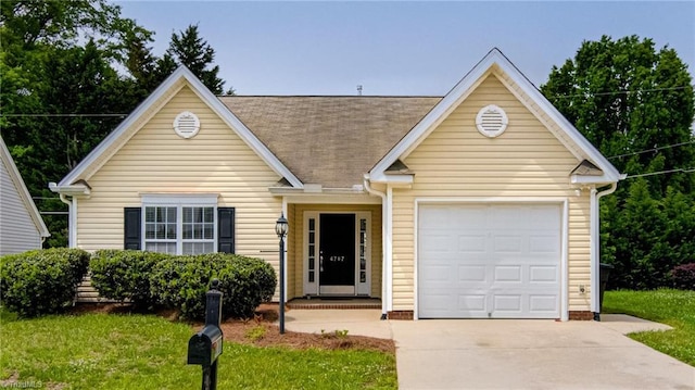 view of front of home featuring a garage, a front lawn, roof with shingles, and concrete driveway