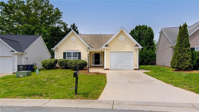 view of front of home with an attached garage, a front lawn, and driveway