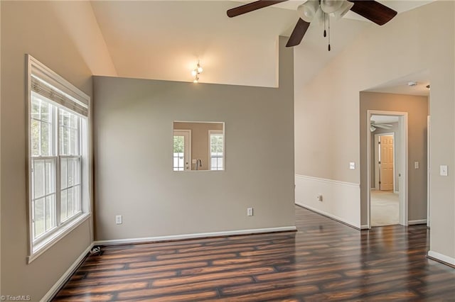 unfurnished room featuring ceiling fan, wood finished floors, and a healthy amount of sunlight