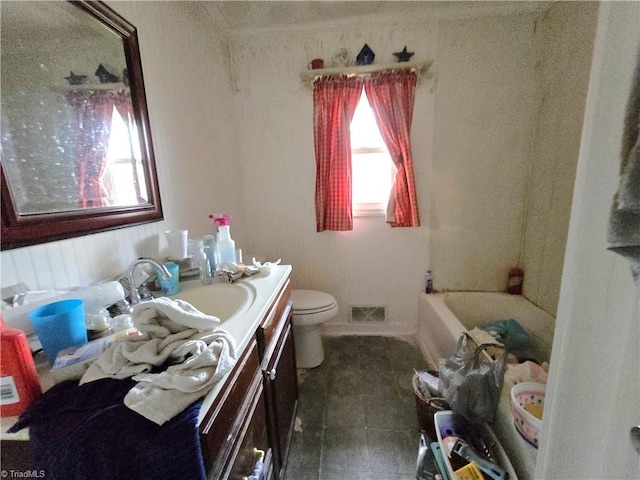 full bath featuring a washtub, visible vents, toilet, vanity, and walk in shower