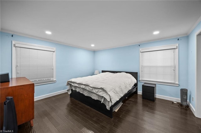 bedroom featuring dark wood-type flooring, baseboards, and recessed lighting