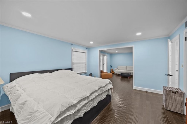 bedroom featuring crown molding, baseboards, and recessed lighting
