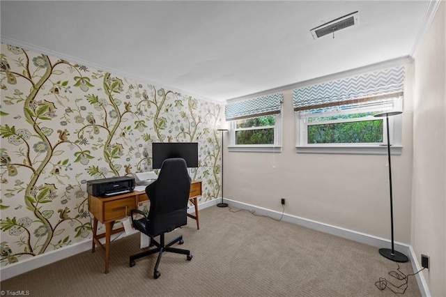 office area with visible vents, baseboards, crown molding, carpet floors, and wallpapered walls