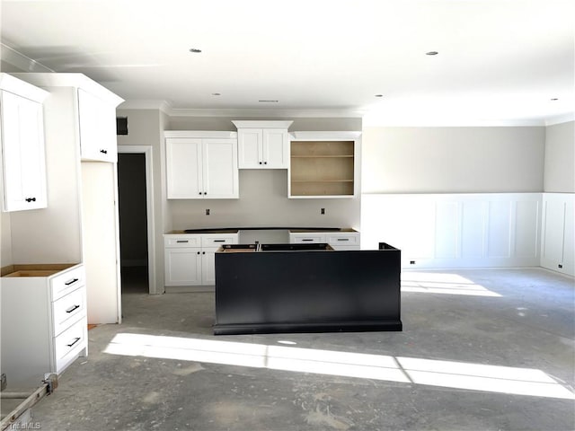 kitchen featuring white cabinets and ornamental molding