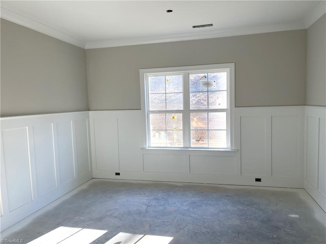 spare room featuring crown molding