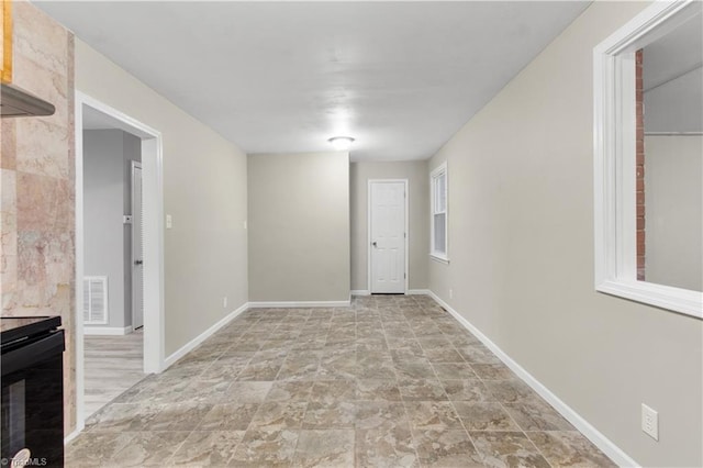 interior space featuring a tile fireplace