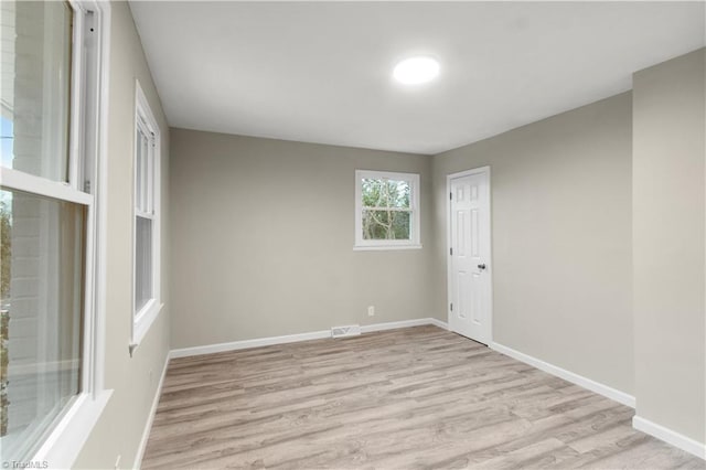 spare room with light hardwood / wood-style floors