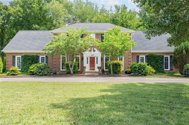 1018 Riverbend Dr, Advance, NC 27006 - view of front of home featuring a front lawn and brick siding