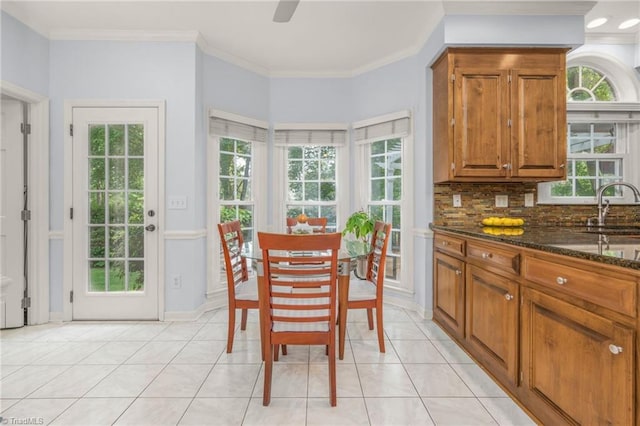 1018 Riverbend Dr, Advance, NC 27006 - dining area with light tile patterned floors and ornamental molding