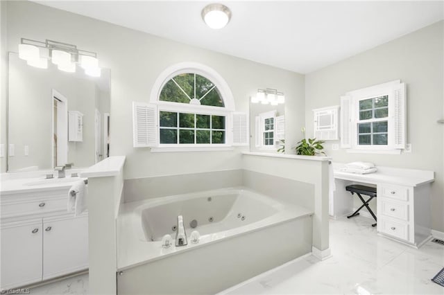1018 Riverbend Dr, Advance, NC 27006 - bathroom featuring marble look tile flooring, vanity, and a tub with jets
