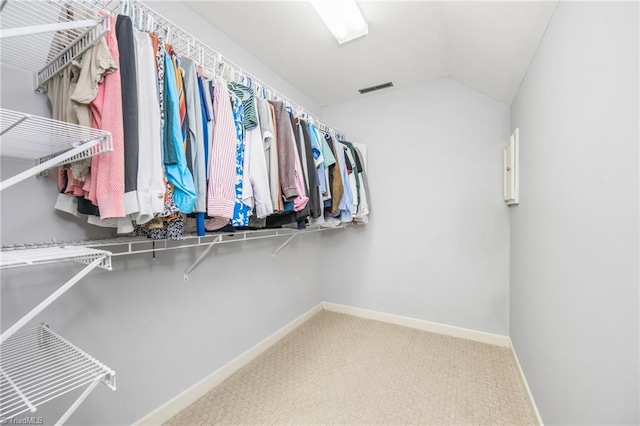 1018 Riverbend Dr, Advance, NC 27006 - spacious closet featuring lofted ceiling and carpet flooring