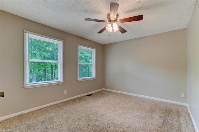 2892 NC Highway 700, Pelham, NC 27311 - carpeted empty room featuring a ceiling fan, a textured ceiling, visible vents, and baseboards