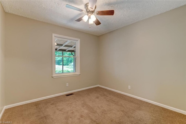2892 NC Highway 700, Pelham, NC 27311 - empty room with visible vents, a textured ceiling, carpet floors, and baseboards