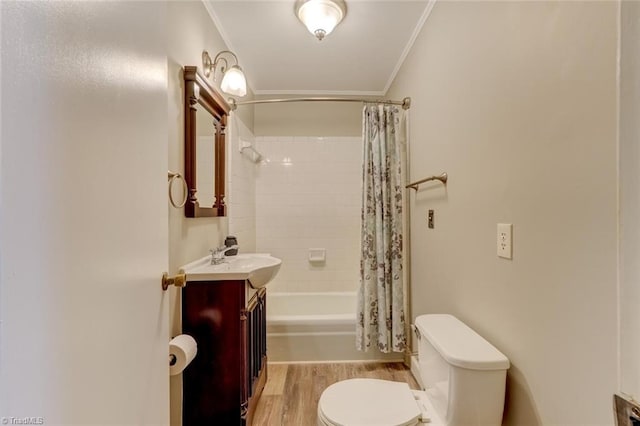 2892 NC Highway 700, Pelham, NC 27311 - full bathroom featuring crown molding, vanity, toilet, shower / bath combo with shower curtain, and wood finished floors