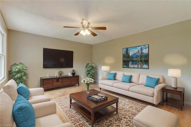 2892 NC Highway 700, Pelham, NC 27311 - living room featuring a ceiling fan, a healthy amount of sunlight, and light wood-style floors