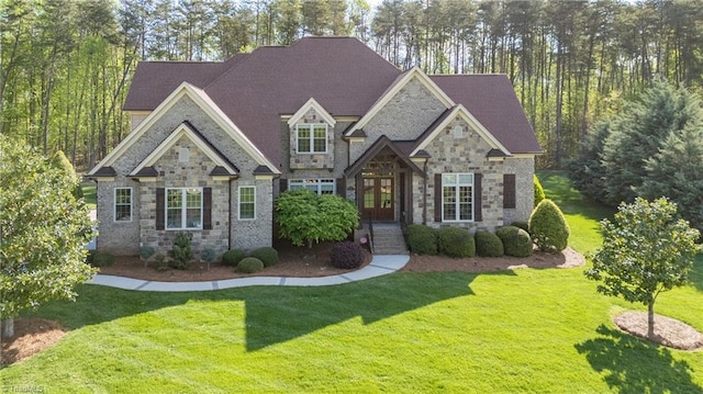7716 Chesterbrooke Dr, Greensboro, NC 27455 - view of front of property with stone siding, a front yard, and a shingled roof